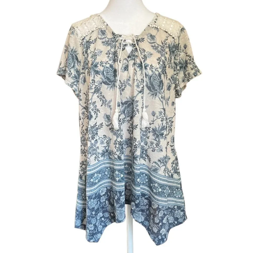 Flowy knit top with lace shoulder accent